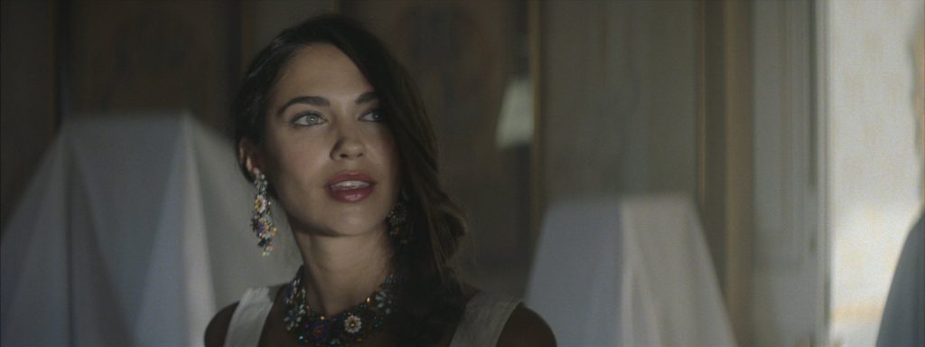 Sweet Matitos fashion film still: portrait of a model with earrings and a necklace